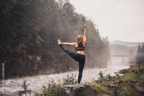 The woman in the wood, meditation outdoors yoga mountain green