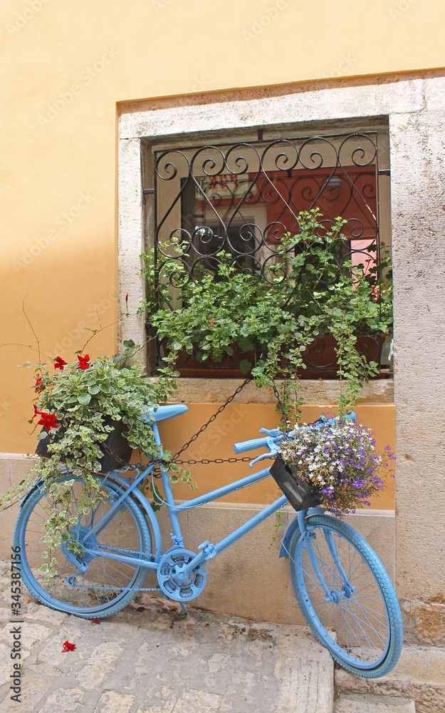 An ornament bike with pots in a street of Rovinj, Croatia