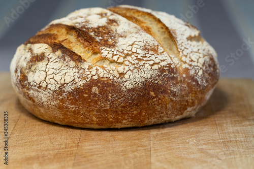 Freshly baked homemade sourdough bread on a wooden board