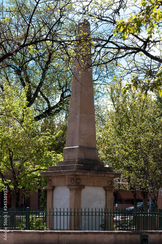 Historic obelisk and trees on the Plaza in Santa Fe, New Mexico