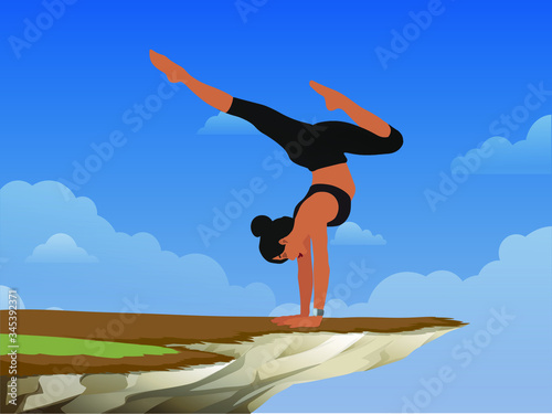 brave girl practices yoga in a pose on a rock