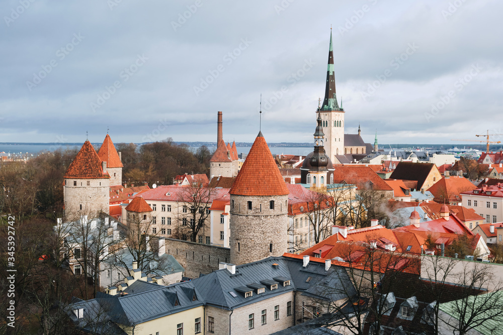 Aerial panoramic cityscape with Medieval Old Town, St. Olaf Baptist Church and Tallinn City Wall, Tallinn, Estonia