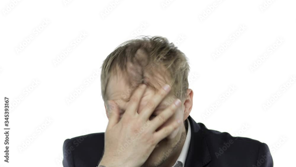 Drank sleepy young businessman with hangover in festive cap. White background Drank sleepy young businessman with hangover in festive cap. White background