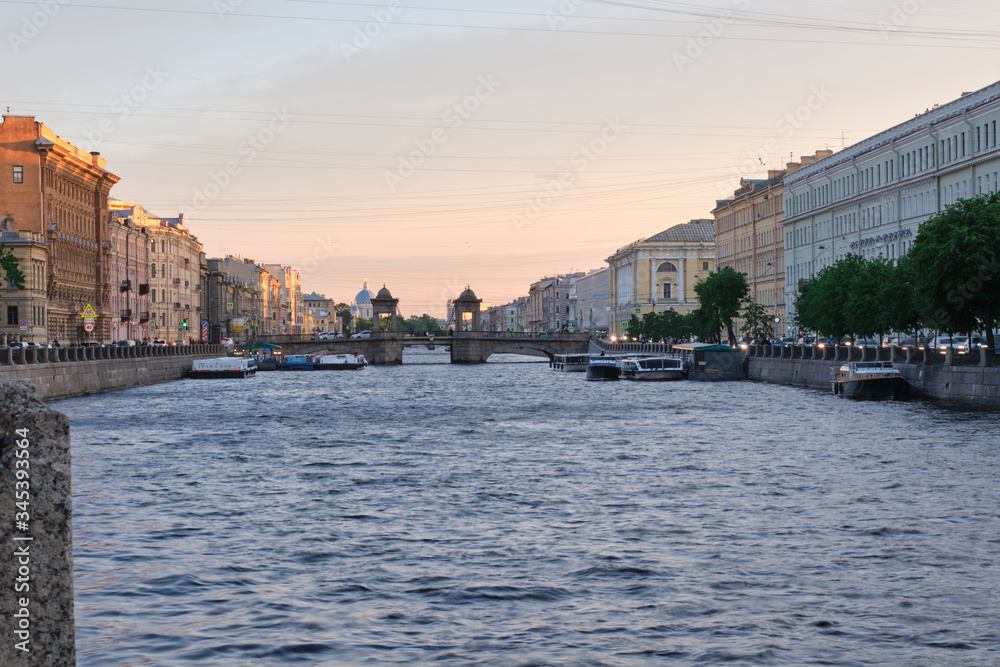 ST. PETERSBURG, RUSSIA - MAY, 2019: Magnificent view of the Fontanka Canal in the center of St. Petersburg. Tourist place. White nights.