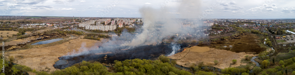 Large-scale fire in the field, lots of smoke and fire Rivne