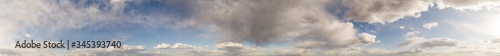 The stormy clouds on sunset panorama