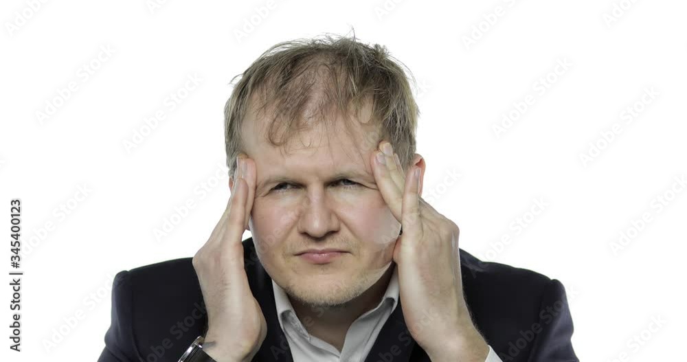 Sleepy young tired businessman. Depressed disheveled worker having headache Sleepy young tired businessman. Depressed disheveled worker having headache