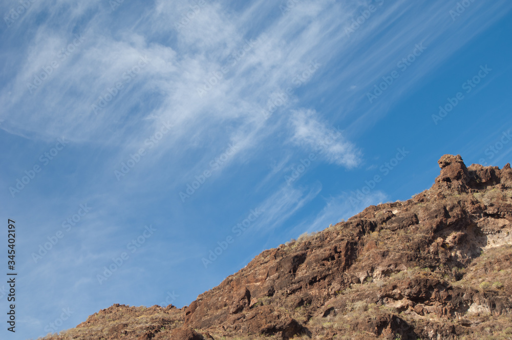 Cliff and clouds in The Nublo Rural Park. Mogan. Gran Canaria. Canary Islands. Spain.