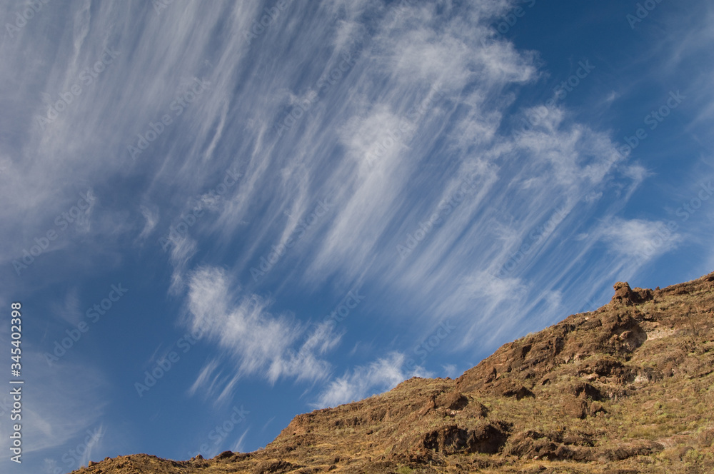 Cliff and clouds in The Nublo Rural Park. Mogan. Gran Canaria. Canary Islands. Spain.