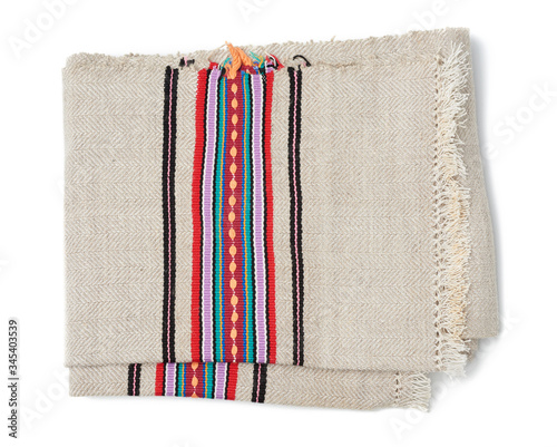 folded gray woven linen towel with colorful inserts