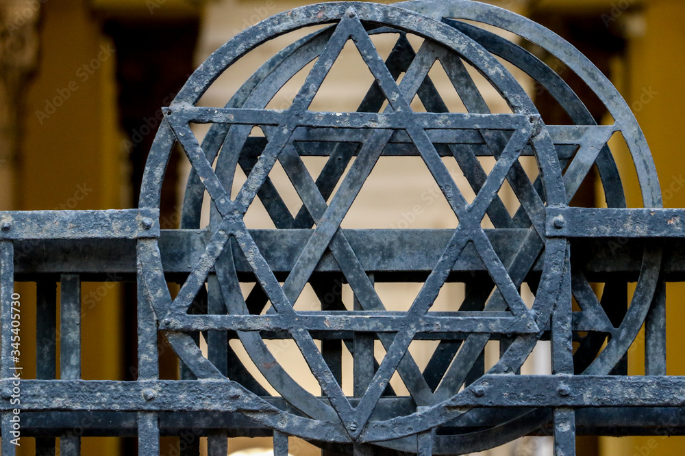Star of David inside a circle on a metal railings