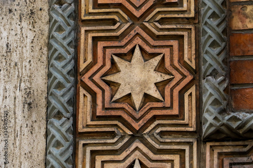 Old eight pointed star tile on a wall