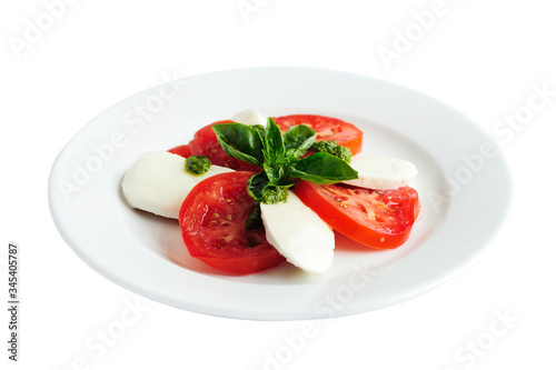 Caprese salad with mozzarella cheese, tomatoes and basil
