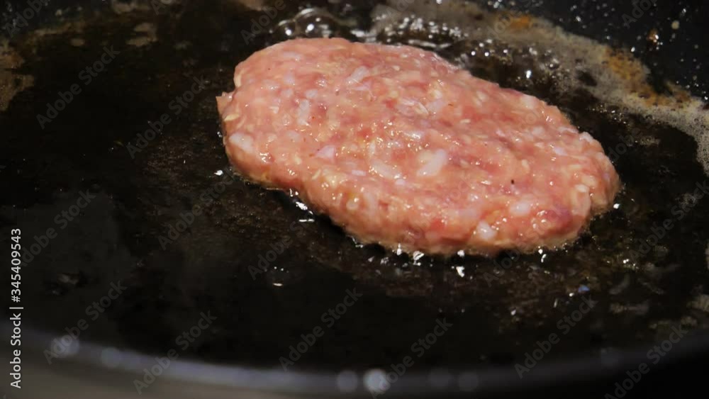 Cooking beef and pork patty for burger. Meat roasted at kitchen. Slow motion. Cooking beef and pork patty for burger. Meat roasted at kitchen. Slow motion.