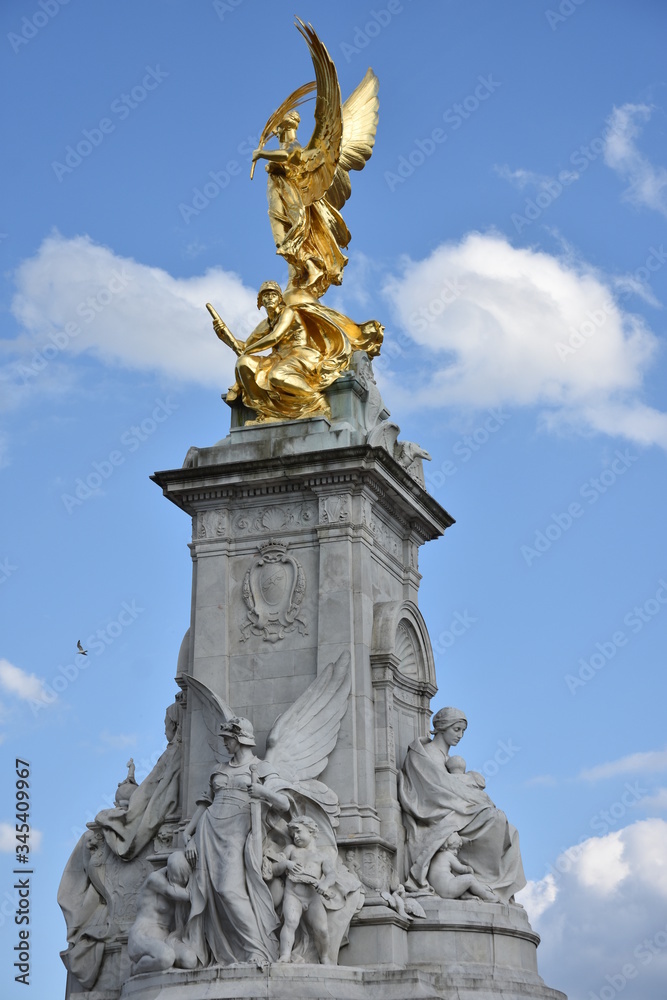 Details of Victoria Memorial - monument to Queen Victoria, located at the end of The Mall in London, and designed and executed by the sculptor Thomas Brock. 