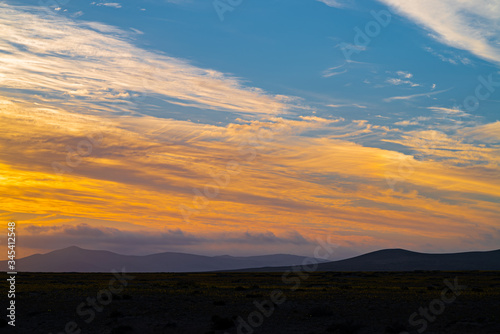 sunset colors reflected in the clouds, in the atacama desert