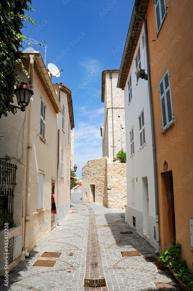 Narrow street in old town of Antibes, French Riviera, Provence, France