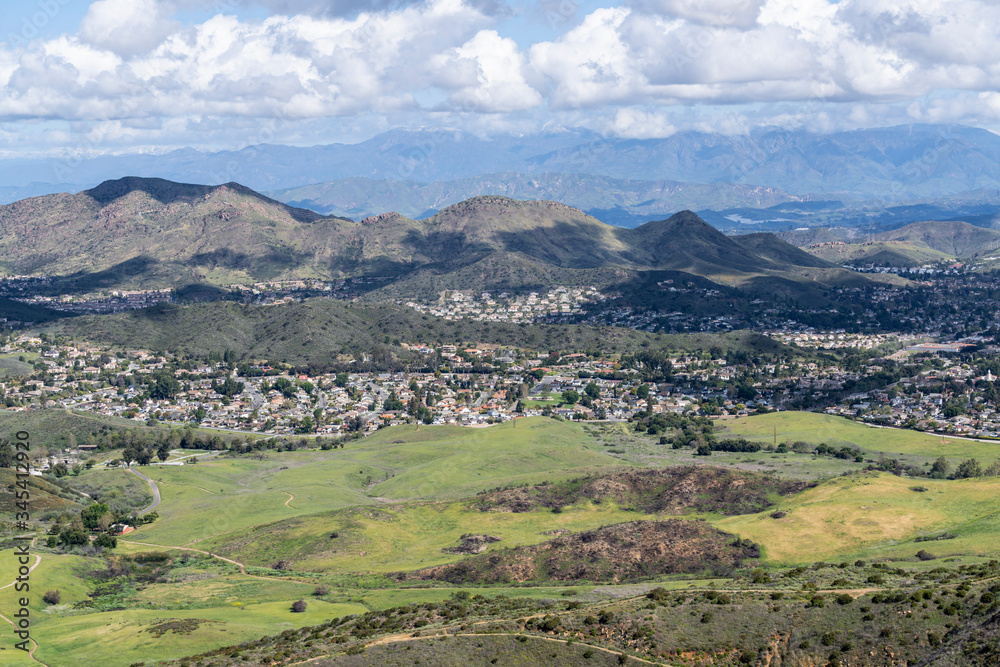 Obraz premium Mountaintop view of nature park meadows and suburban homes in scenic Newbury Park near Los Angeles, California.