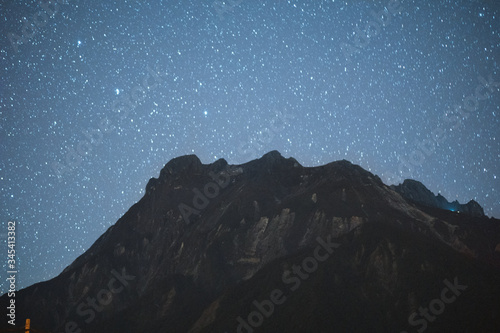 Malaysia, 3 May 2020 - Nature landscape view of mountain range with stars on night. Mount Kinabalu