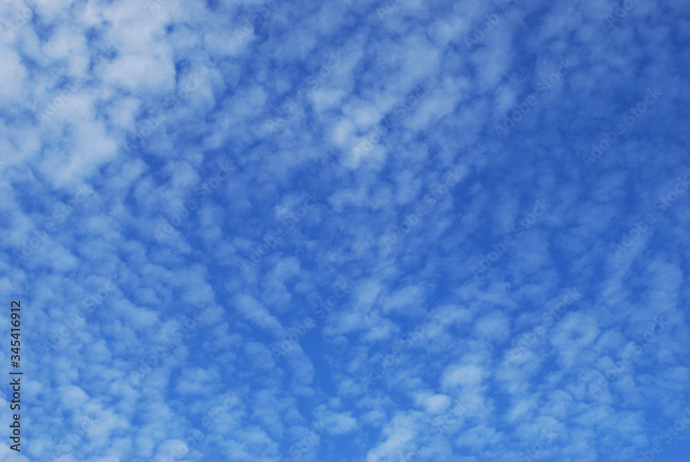 delicate patterns of white clouds in the blue sky
delicate patterns of white clouds in the blue sky