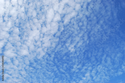  delicate patterns of white clouds in the blue sky