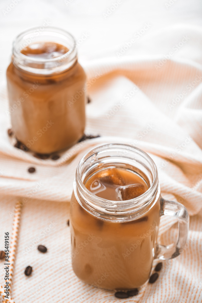Mason jar of tasty iced coffee on table Mason jar of tasty iced coffee on table