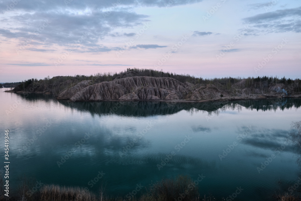 Sandy quarry with blue water called Conduky or Romance Mountains