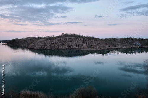 Fototapeta Naklejka Na Ścianę i Meble -  Sandy quarry with blue water called Conduky or Romance Mountains