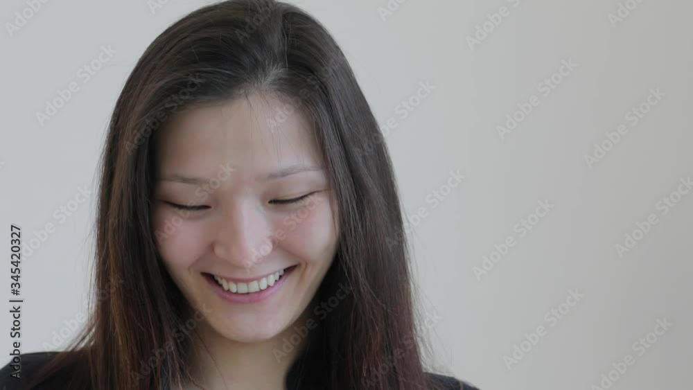 Portrait of a cheerful girl in a protective mask. The person has an excellent mood despite self-isolation.