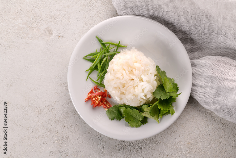 portion of rice seasoned with greens and red pepper
