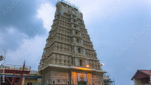 Timelapse of Hindu Temple Tower with dramatic clouds in the background. Chamundi Temple photo