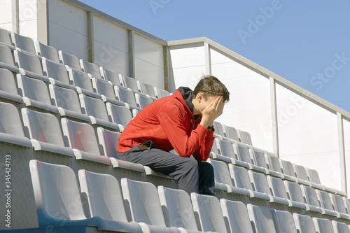 fan sitting in the stadium became upset and began to cry