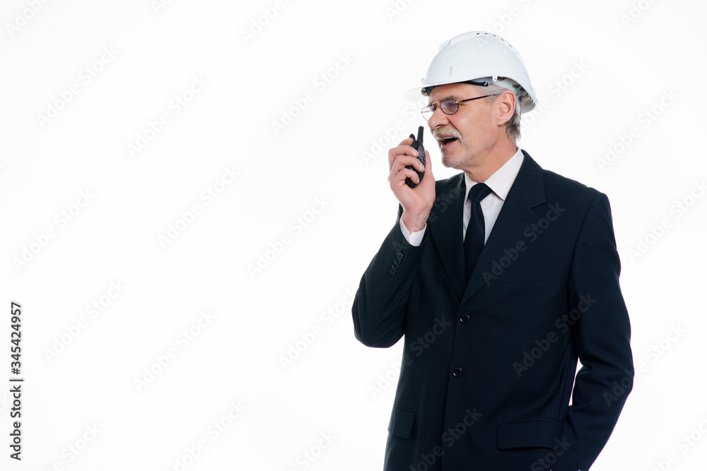 Portrait of successful business man, civil engineer and architect wear a white safety helmet speak by sense with copy space in white background Portrait of successful business man, civil engineer and architect wear a white safety helmet speak by sense with copy space in white background