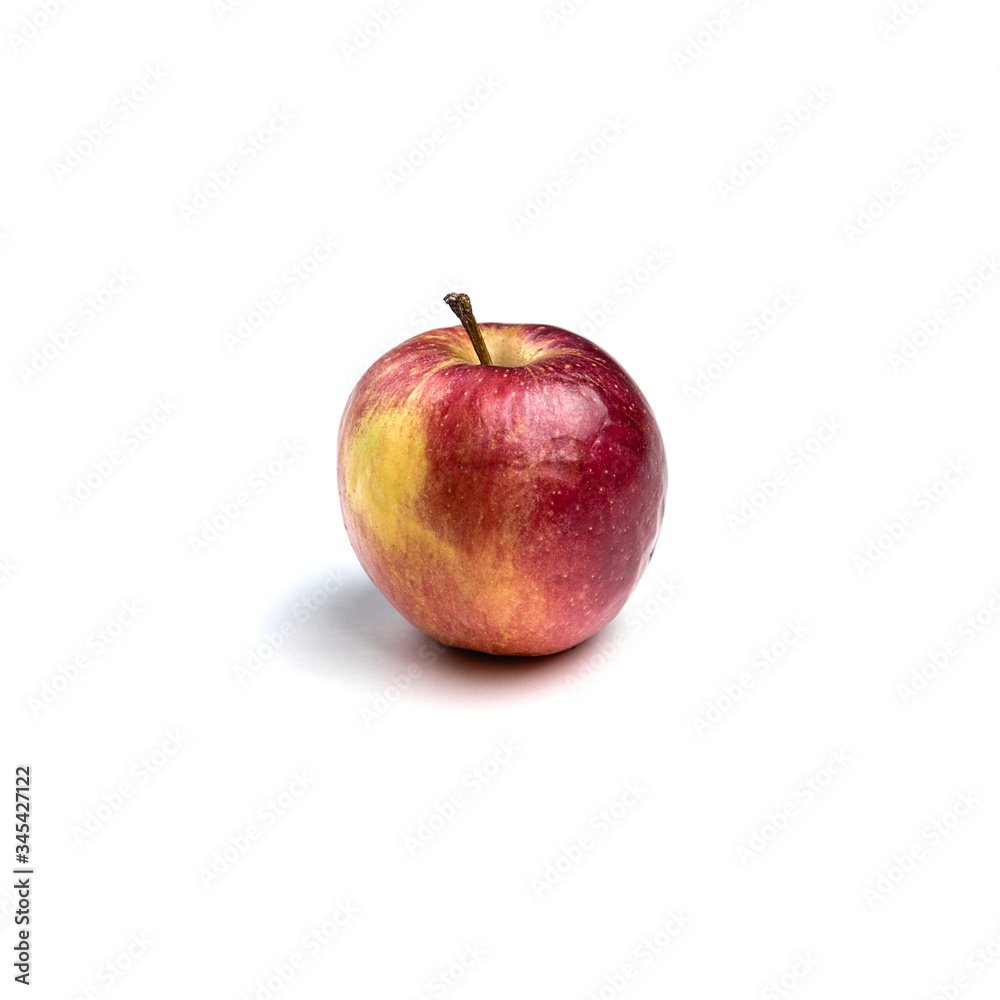 A ripe red Apple isolated on a white background. Organic product. Agricultural industry. Beautiful shiny Apple A ripe red Apple isolated on a white background. Organic product. Agricultural industry. Beautiful shiny Apple