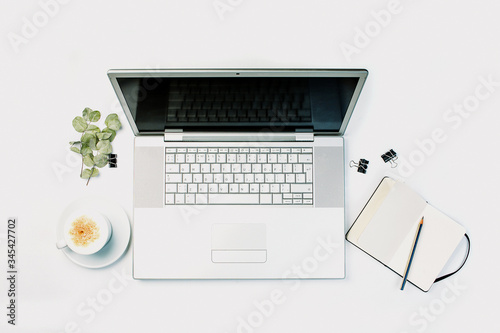 White desk office with laptop, top view flatlay