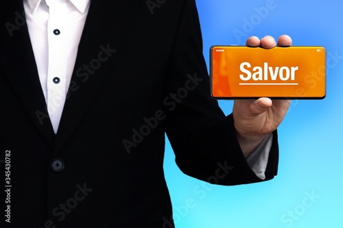 Salvor. Lawyer in a suit holds a smartphone at the camera. The term Salvor is on the phone. Concept for law, justice, judgement photo