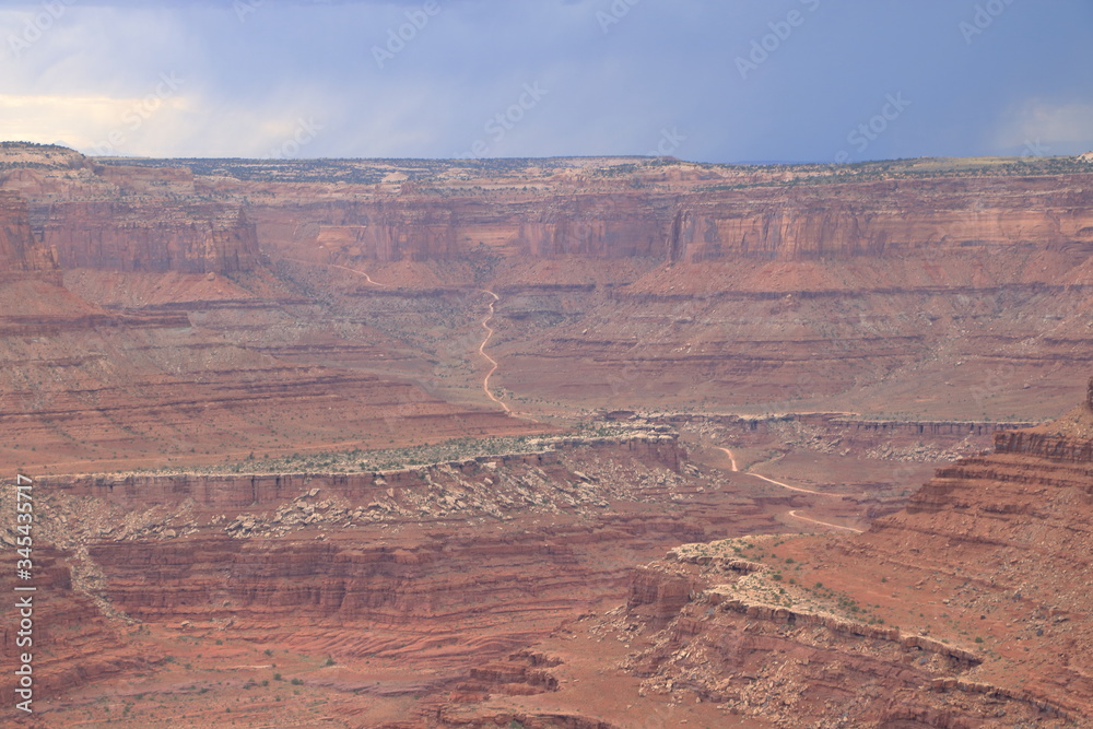 Highway leading into Canyonlands National Park on a stormy afternoon from Dead Horse Point, Utah Highway leading into Canyonlands National Park on a stormy afternoon from Dead Horse Point, Utah
