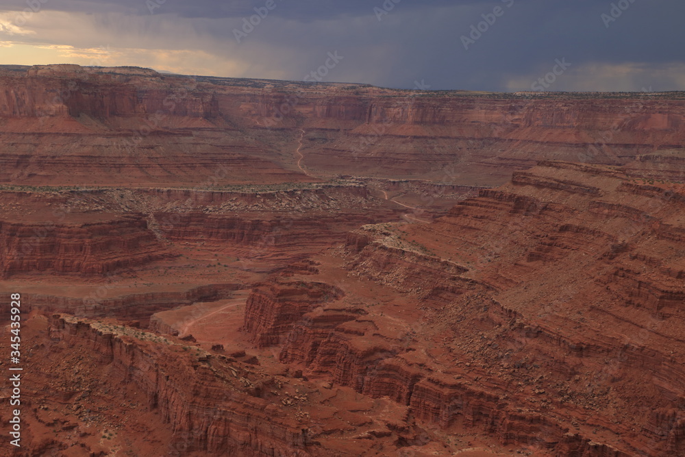 Highway leading into Canyonlands National Park on a stormy afternoon from Dead Horse Point, Utah