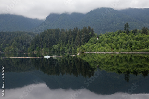 Fototapeta Naklejka Na Ścianę i Meble -  Capilano Lake  in mountains on cloudy morning in B.C. Canada