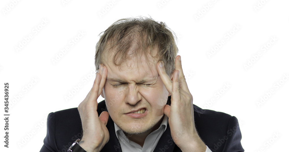 Sleepy young tired businessman. Depressed disheveled worker having headache Sleepy young tired businessman. Depressed disheveled worker having headache