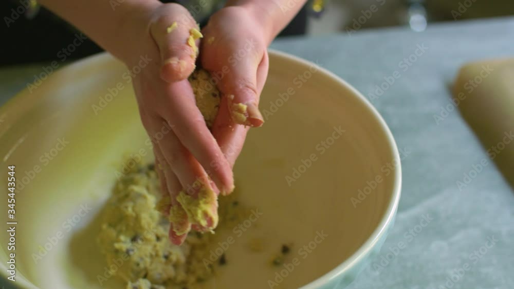 Female hands rolling cookies from mixture, interior, 4K Female hands rolling cookies from mixture, interior, 4K
