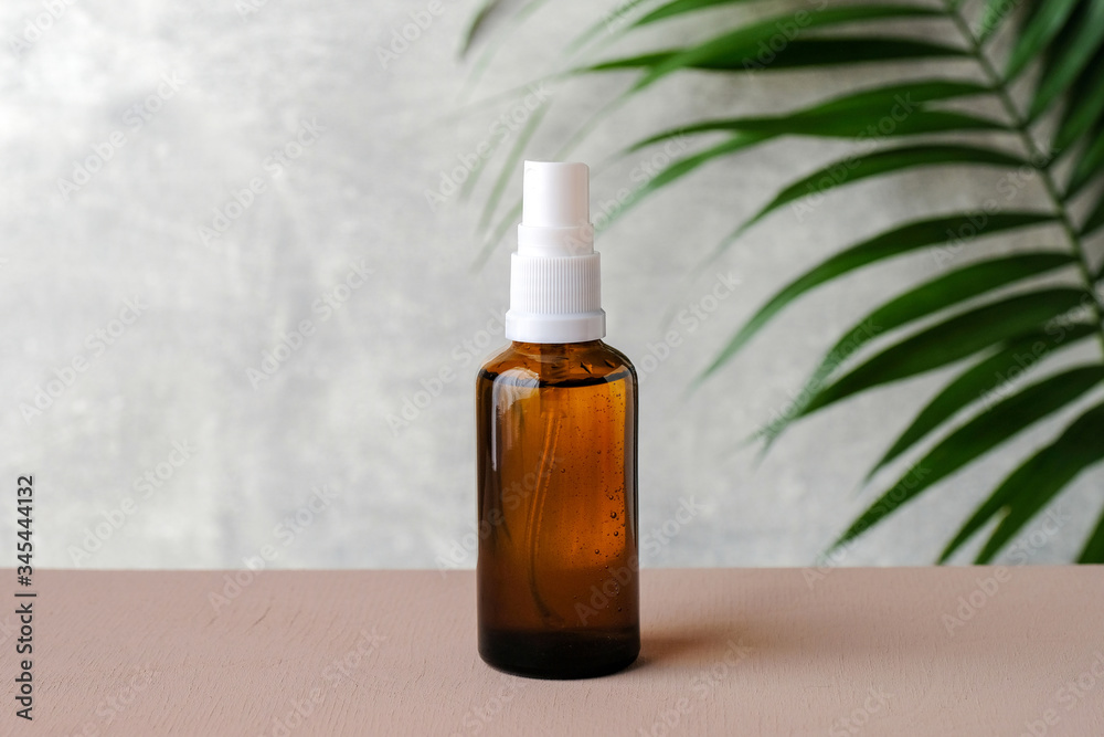 Clear amber glass spray bottle mockup with tropical green leaf. Natural  organic cosmetic or herbal medicine product. Minimal style brand packaging  mockup. Healthcare concept Photos | Adobe Stock