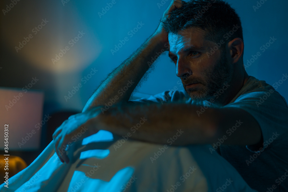 Ταπετσαρία dramatic portrait in the dark of attractive depressed and worried man on bed suf