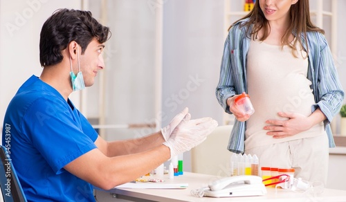 Pregnant woman visiting doctor for check-up