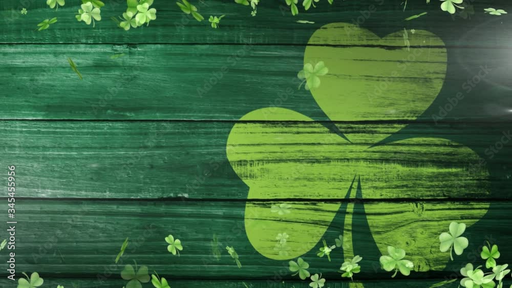 Animation of green clovers floating with clover leaf on background for St. Patricks day