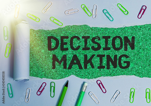 Writing note showing Decision Making. Business concept for The act of deciding between two or more possibilities photo