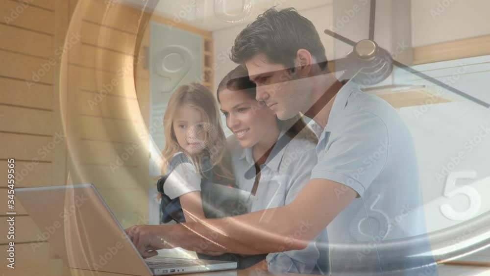 Animation of a Caucasian couple and their daughter using a laptop computer over a moving clock Animation of a Caucasian couple and their daughter using a laptop computer over a moving clock
