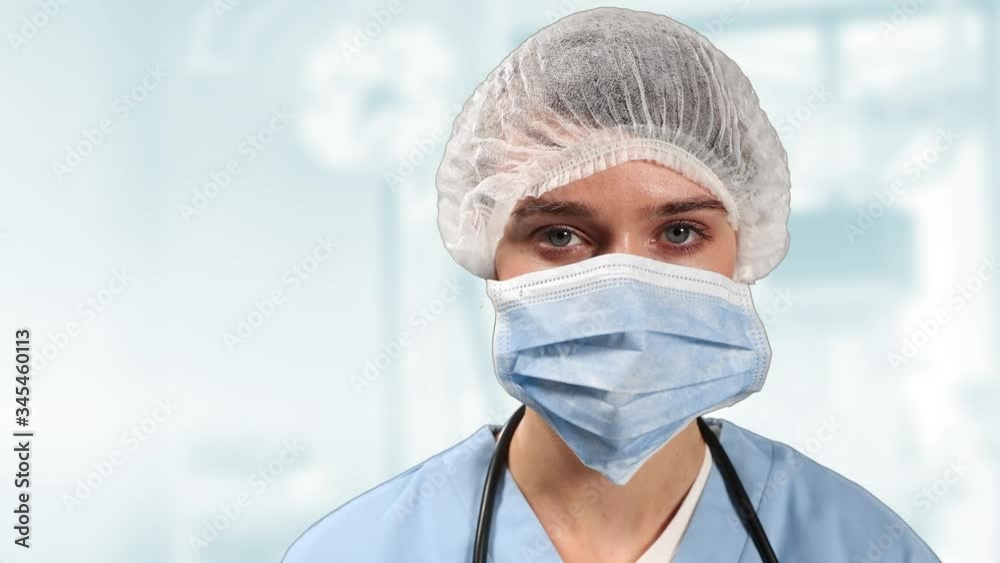 Animation of female doctor wearing coronavirus Covid-19 mask looking at camera Animation of female doctor wearing coronavirus Covid-19 mask looking at camera