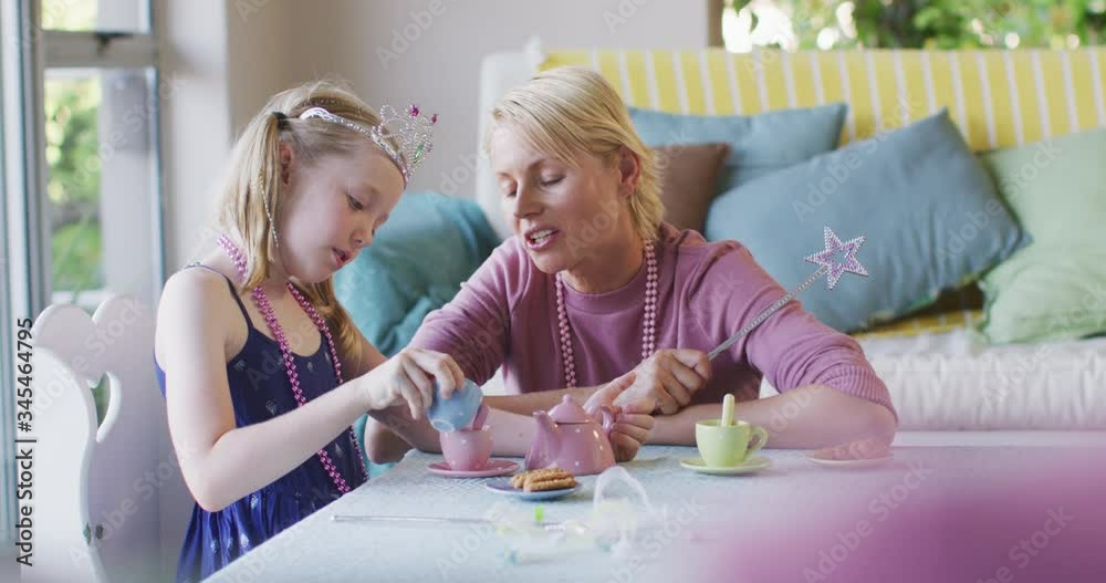 Caucasian woman playing with her daughter at home Caucasian woman playing with her daughter at home