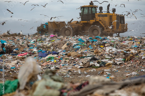 Rubbish piled on a landfill full of trash  photo